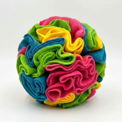 Dog snuffle ball in bright multicolour fleece — pink, blue, green and yellow — on white background — washable dog enrichment treat ball