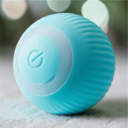 Blue ribbed automatic rolling ball toy with glowing ring on bokeh light background — interactive smart pet ball toy